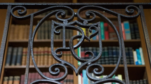 A detail of ironwork with a "D" and a "C"